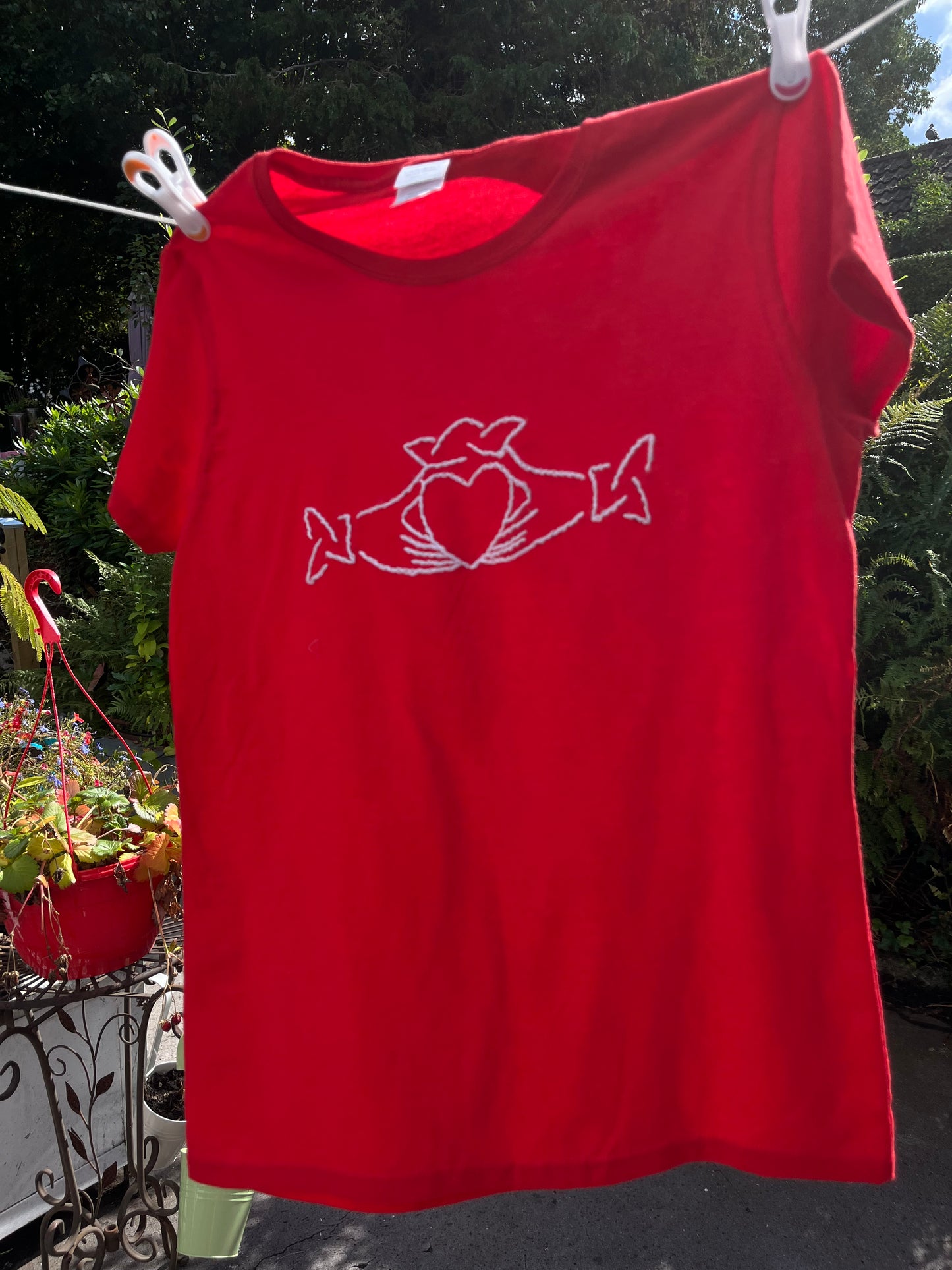 Red tee with embroidered claddagh